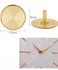 Brass cap from Ten Piece Clock Repair Kit with nuts, washers, rubber rings, and brass caps for silent movement clocks.