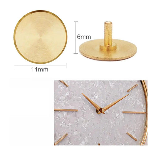 Brass cap from Ten Piece Clock Repair Kit with nuts, washers, rubber rings, and brass caps for silent movement clocks.