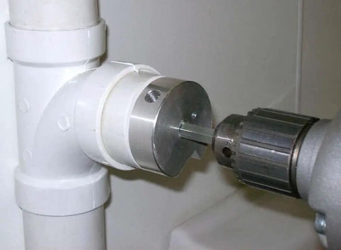 PPR100 Clean Ream Extreme Aluminum Head Pipe Reamer inserted in PVC fitting for reaming, showing 1/4 inch hex shaft