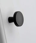 Close-up of a matte black cabinet knob installed, 30 Pack Go To Matte Black Cabinet Knobs For Cabinets And Dresser Drawers
