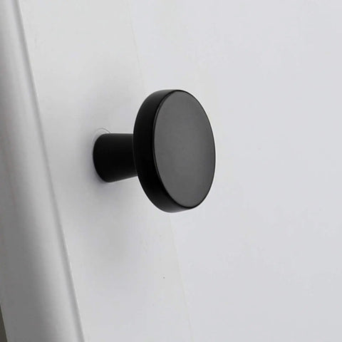 Close-up of a matte black cabinet knob installed, 30 Pack Go To Matte Black Cabinet Knobs For Cabinets And Dresser Drawers