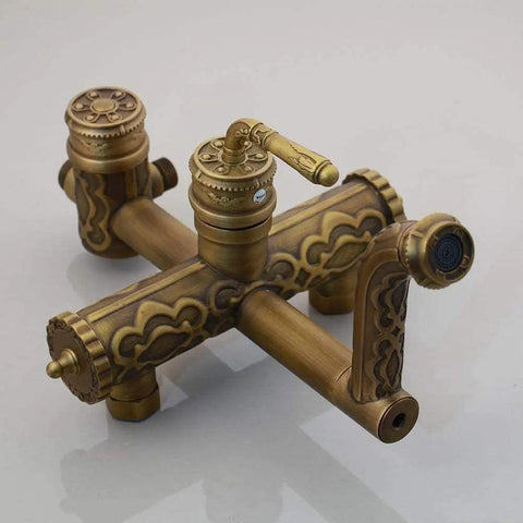 Heavy Duty Solid Brass Shower System Featuring Eight Inch Rainfall Head And Detachable Handheld Sprayer Lead Free Wall Mounted Bath Faucet Rock Solid Build ornamental brass faucet with intricate design and multiple knobs.