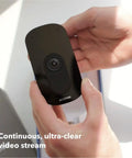 Person holding Indoor WiFi Security Camera With 1080p HD Video, 180 Degree Field Of View, clear night vision, black color
