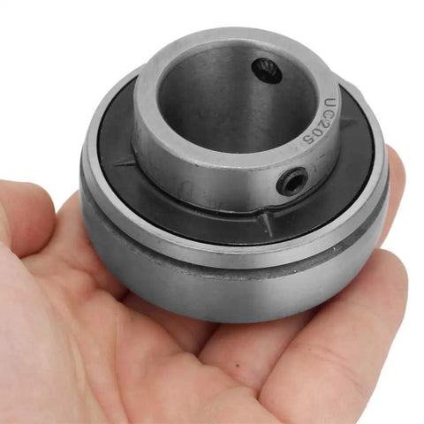 Person holding Flange Mounted Pillow Block Insert Bearing With Self Aligning Ball Bearing 25mm Bore 52mm OD Steel Housing Built Tough