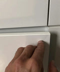 Set Of Three Push To Open Cabinet Latches With Silent Magnetic Catch For Dead Simple Drawer Opens Light Finger Tap Action Silver Kitchen Hardware Upgrade showing a hand gently pressing a cabinet door.