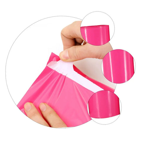 Close-up of hands using waterproof pink poly mailer bags pack of 100 size 17 by 30 cm thickened puncture resistant for shipping and storage