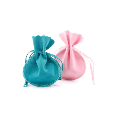 Turquoise and pink velvet jewelry pouches, drawstring closure, for rings and earrings display and storage.