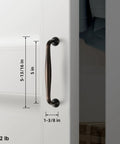 Oil Rubbed Bronze Cabinet Pulls with 5 Inch Hole Centers, shown on white cabinet, displays spindle style and deep antique warm finish
