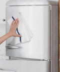 Person using Value Pack Of 36 Absorbent 16x19 Inch Terry Cloth Cleaning Rags For Home And Business on a refrigerator door.