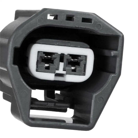 Heavy Duty 12V Vacuum Pump For Power Brake Booster With Proven Muscle And Zero Drama Mounting connector detail, gray plastic, two-pin design.