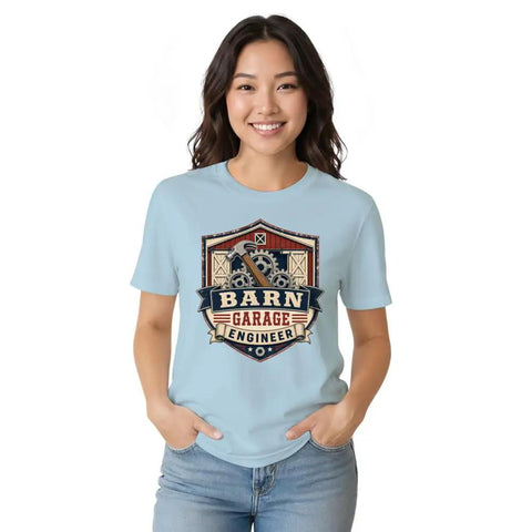 Classic Retro Mechanical Engineer Tee With Vintage Barn Garage Gear Badge Design For Hands-On Builders And Tool Loving Tinkerers In 100 Cotton, model wearing light blue t-shirt.