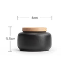 Kick Up Your Pantry Game With These Heavy Duty Ceramic Tea Jars And Coffee Tins Featuring Snug Airtight Wood Lids To Lock Down Freshness For Spices Sugar And Daily Groceries Sets Of Four, black ceramic jar with wooden lid, 8cm wide x 5.5cm tall.