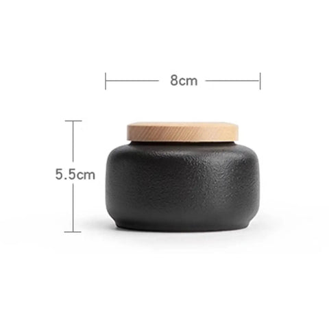 Kick Up Your Pantry Game With These Heavy Duty Ceramic Tea Jars And Coffee Tins Featuring Snug Airtight Wood Lids To Lock Down Freshness For Spices Sugar And Daily Groceries Sets Of Four, black ceramic jar with wooden lid, 8cm wide x 5.5cm tall.
