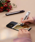 Woman using Your Go To 4 In 1 Mini Heat Press Kit With 3 Second Fast Heating for hot stamping on gold foil.