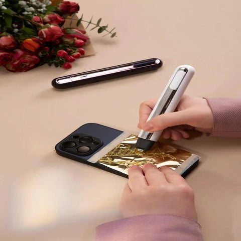 Woman using Your Go To 4 In 1 Mini Heat Press Kit With 3 Second Fast Heating for hot stamping on gold foil.