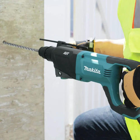 Person using Beast Mode 8 Amp SDS Plus AVT Rotary Hammer With D Handle 1 Inch Chuck Two Point One Ft Lbs Impact Energy on concrete