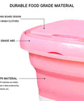 Detail of pink Compact Foldable Portable Washing Machine With Spin Dryer Bucket showing washing board design and materials.