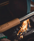 Japanese Weeding Sickle Long Handle Garden Hoe with Durable Ash Wood Handle being sharpened with sparks flying off the blade