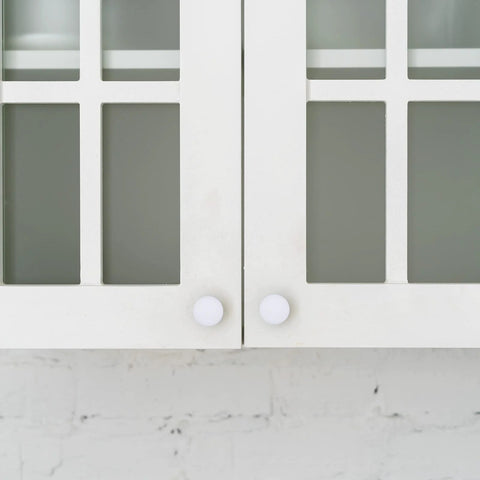 Front view of cabinets with Four Sizes White Plastic Hole Plugs For Cabinet And Furniture Round End Caps For Screw Holes installed