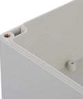Weatherproof Outdoor Electrical Junction Box With Hinged Cover For Industrial Wiring And Control Systems Plastic Enclosure For No Fuss Tool Free Access Durable All Weather Wiring Box For Equipment Installation And Maintenance, close-up corner