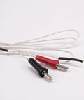 Front view of two K-type thermocouple sensors with red and black handles, braided white cables, stainless-steel tips