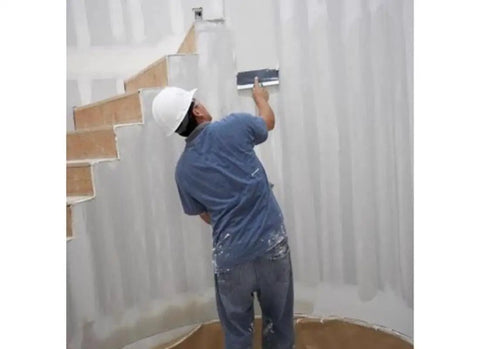 Worker applying 18Lb EZ Sand 45 Joint Compound For Drywall And Painting Projects, Sandable Natural Gypsum Formula Pro Grade to wall