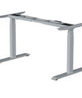 Stylish Grey Dual Motor Electric Standing Desk Frame With Built In Usb A Plus C Charging Ports Smooth Height Adjustable Sit Stand Base Sturdy Steel Legs For Home Office Workstation Setup Super Easy To Assemble, viewed from side angle.