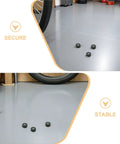 Motorcycle Rubber Grommet Kit For Easy Install And Smoother Rides, Two Set Shock Absorption Ring Buffers, Durable Rubber And Metal Construction, Reduces Road Vibration On Long Distance Journeys, three black rubber grommets on garage floor near wheel