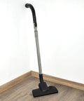 Miele Vacuum Extension Wand 35mm Stainless Steel Telescoping Tube For C1 C2 C3 Vacuums in a corner of room