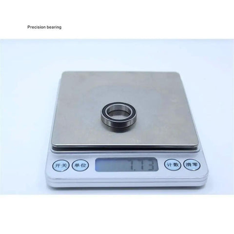 10 Pack Premium 6803 RS Deep Groove Ball Bearings on digital scale showcasing precise 17mm by 26mm size.