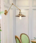 Dang Solid Industrial Wall Sconce With Adjustable Swing Arm And Vintage Bronze Metal Design. Adjustable lamp with warm light.