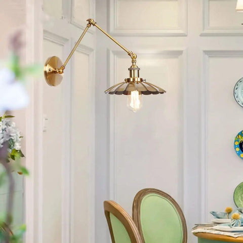 Badass Heavy Duty Swing Arm Wall Lamp, Adjustable Bronze Sconce, Vintage fixture in cozy dining area with green chairs.