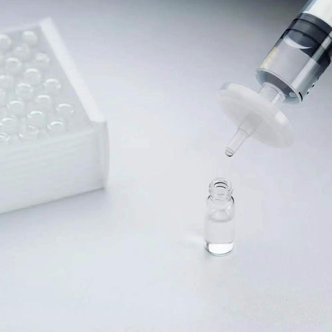 Hydrophobic PTFE Syringe Filters, 25mm Diameter, 0.45 Micron Pore, Pro Grade Lab Filtration in use with syringe and vial