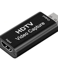 Black HDTV video capture card with USB output and HDMI input for recording and streaming.