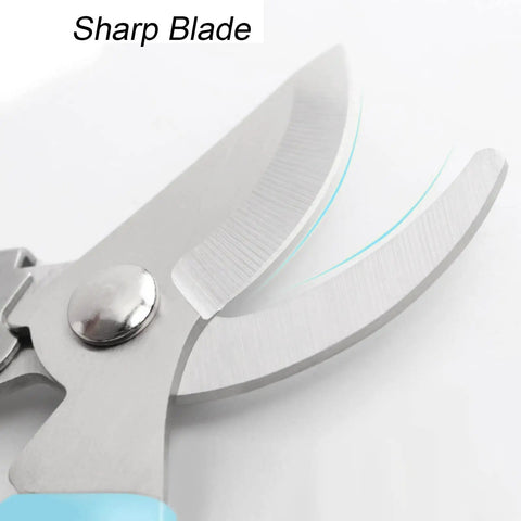 Close-up of sharp blades on pink-handled bypass garden scissors for flowers herbs roses and small pruning jobs stainless steel shears.