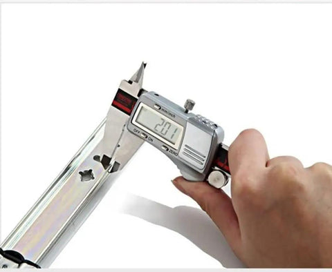 Hand measuring 14 inch Heavy Duty Ball Bearing Drawer Slides with digital caliper, ensuring precise dimensions for installation.