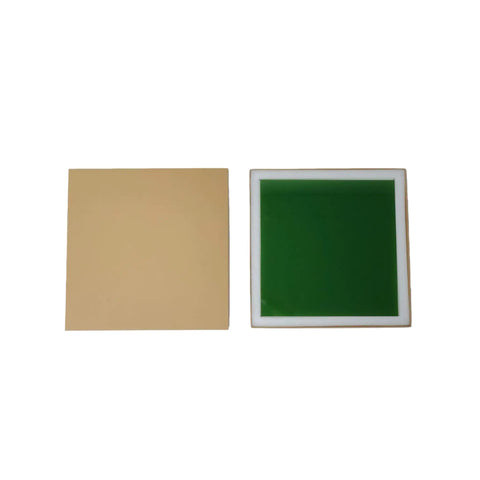 Top Shelf 12 X 12 X 0.2 Inch Laser Safety Window Panel Built Tough For Heavy Duty Fiber Lasers with green tint and beige background.