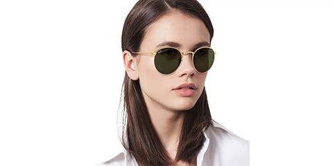 Woman wearing RB3447N Round Metal Sunglasses with Flat Lenses Gold Frame and Green G-15 Lenses Unisex 50mm Classic Round Style