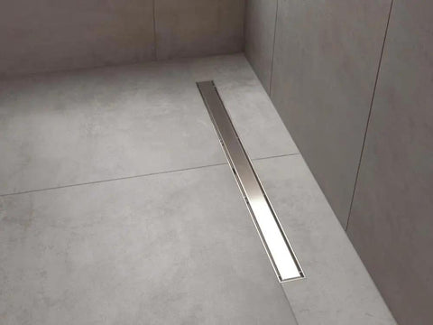 36 Inch Reversible Linear Shower Drain In Stainless Steel With Hair Catcher And Leak Resistant Seal For No Sweat Install shown on sleek shower floor.