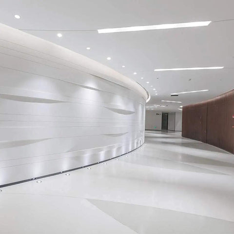 Sorfia 10pcs 2 inch Gimbal LED Recessed Light Small Recessed Lights AC110V illuminating a modern curved corridor.