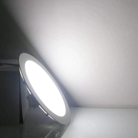 Illuminated 7 Inch 18W LED Recessed Ceiling Light Ultra Thin Downlight 6000K Daylight White Retrofit Kit on white surface