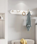 Heavy Duty Wrought Iron Wall Coat Hooks With Zero Hassle Setup For Bedroom And Entryway Modern Five Arm Rack hanging a towel in a stylish room.