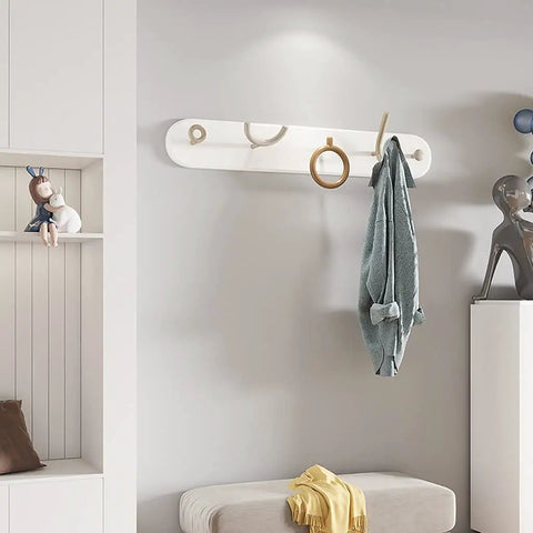 Heavy Duty Wrought Iron Wall Coat Hooks With Zero Hassle Setup For Bedroom And Entryway Modern Five Arm Rack hanging a towel in a stylish room.
