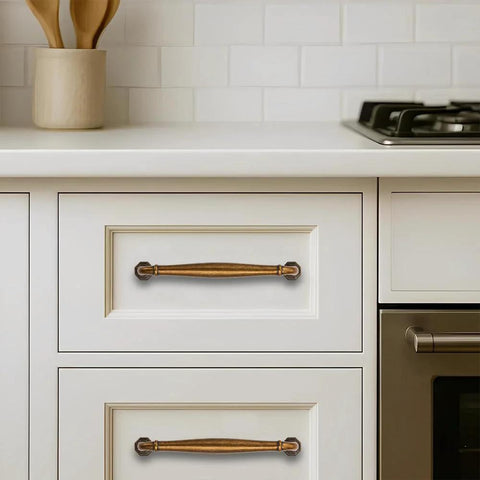 10 Pack 4 Inch Center To Center Antique Brass Cabinet Pulls installed on white kitchen cabinets