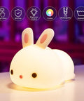 Lit Cute Bunny Night Light For Kids With 16 Colors Tap Control Dimmable Lamp on table, soft glow, bunny shape, teen room decor.