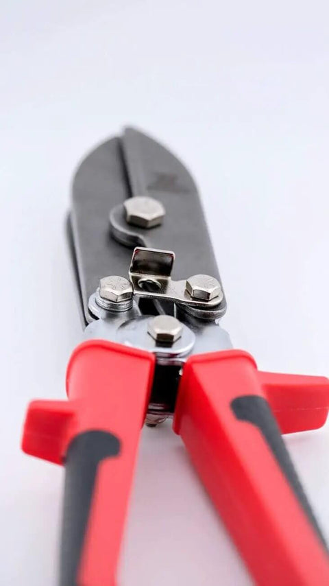 Close-up of 16-142 5-Blade Sheet Metal Crimper with ergonomic RedLine handles for HVAC installations and tight, leak-proof crimps.