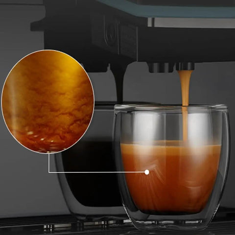 Close-up view of espresso pouring into a glass from a Fully Automatic Espresso Machine With Ceramic Flat Burrs And Nine Grind Size Options.