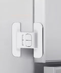 Sticky Mount Automatic Fridge Door Closers Set installed on cabinet door for locking mechanism, nonslip adhesive visible