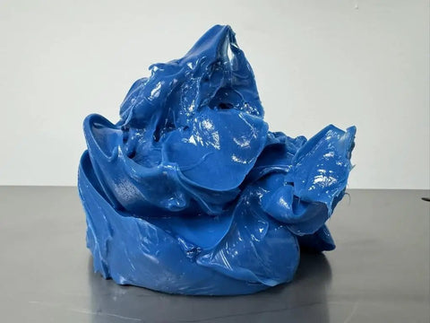 Blue Lithium Complex Grease Multipurpose Lubricant NLGI 2 EP for Automotive and Construction, visible in a solid form.