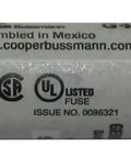 Close-up of a 30 Amp Class G Time Delay Fuse For 480V Systems, showing label and metal ends, suitable for appliances, 1.62 by 0.41 inch.